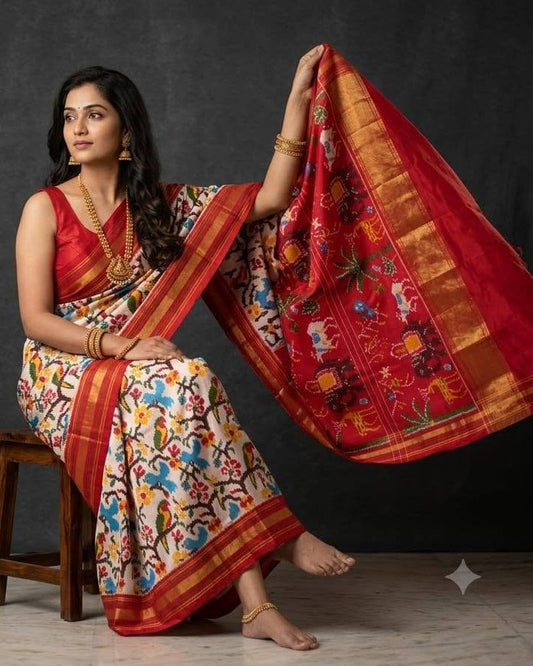 White and Red Patola Saree with Traditional Elephant Motifs and Gold Zari Pallu