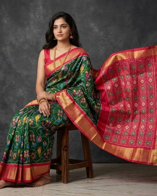 Green and Pink Patola Saree with Traditional Floral Motifs and Rich Magenta Zari Pallu