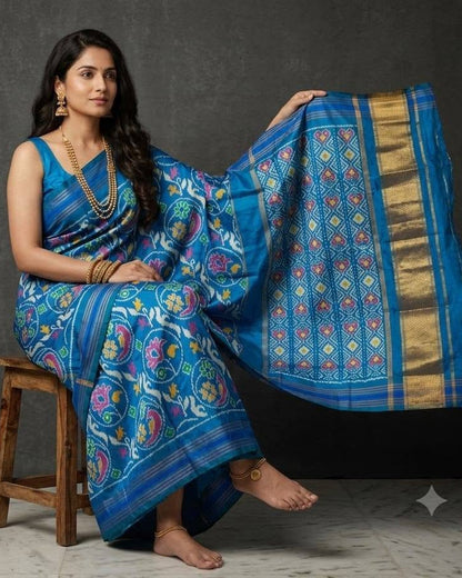 Sky Blue Patola Saree with Traditional Floral Motifs and Grid-Patterned Zari Pallu