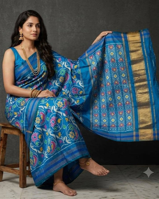 Sky Blue Patola Saree with Traditional Floral Motifs and Grid-Patterned Zari Pallu