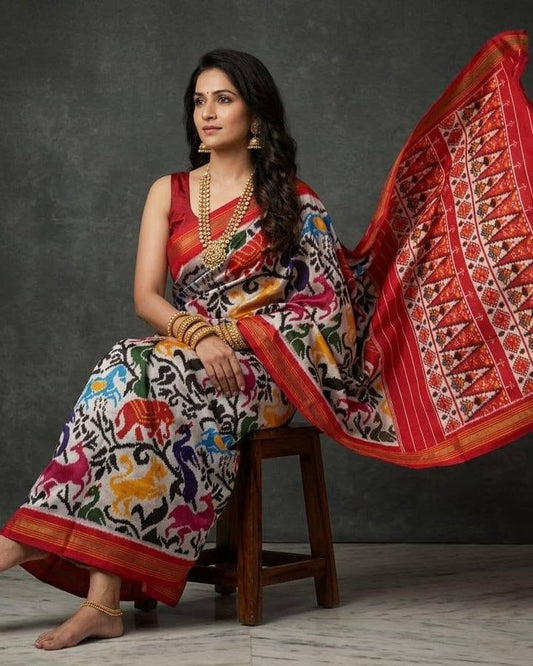 Ivory and Red Patola Saree with Multicolored Animal Motifs and Geometric Pallu