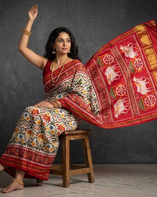 Ivory and Red Patola Saree with Traditional Chariot Motifs and Golden Zari Border